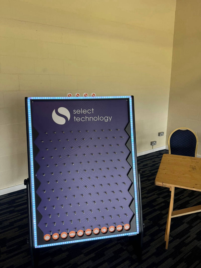 Select Technology branding for the Plinko Game.